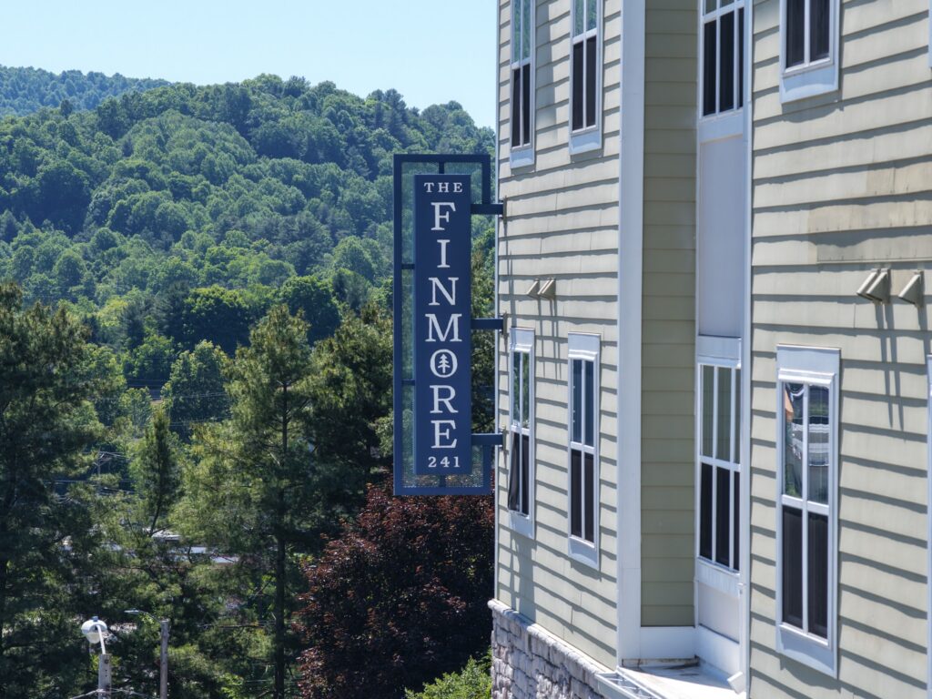 Apartment exterior with The Finmore at 241 signage