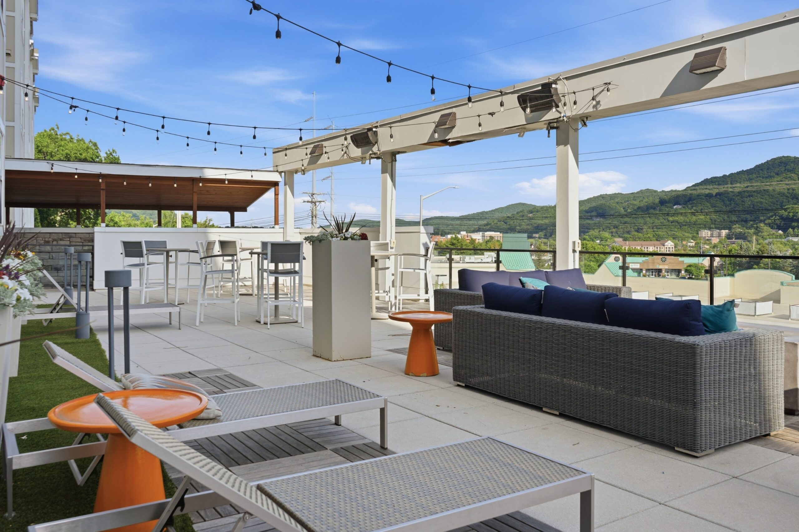 Large patio with multiple seating areas and sun deck scaled