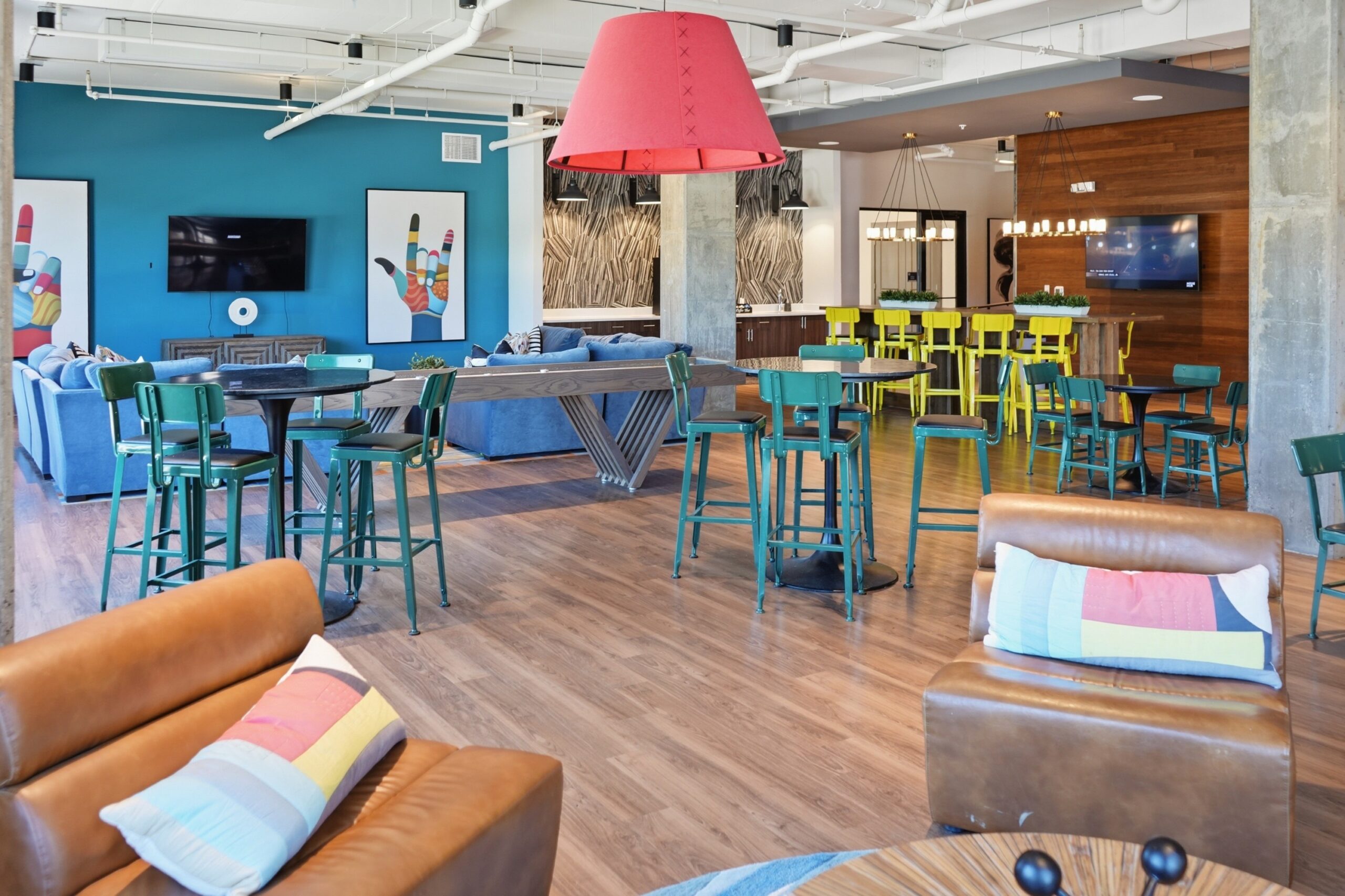 Resident clubhouse with multiple gathering areas and games scaled